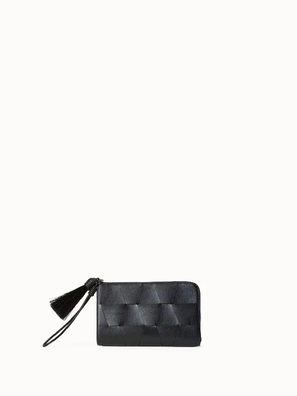 Women's cropped leather jackets with silver zippers for a punk - inspired outfit Alexa Tassle Pouch Women's cropped leather jackets with silver zippers for a punk - inspired outfit Alexa Tassle Pouch