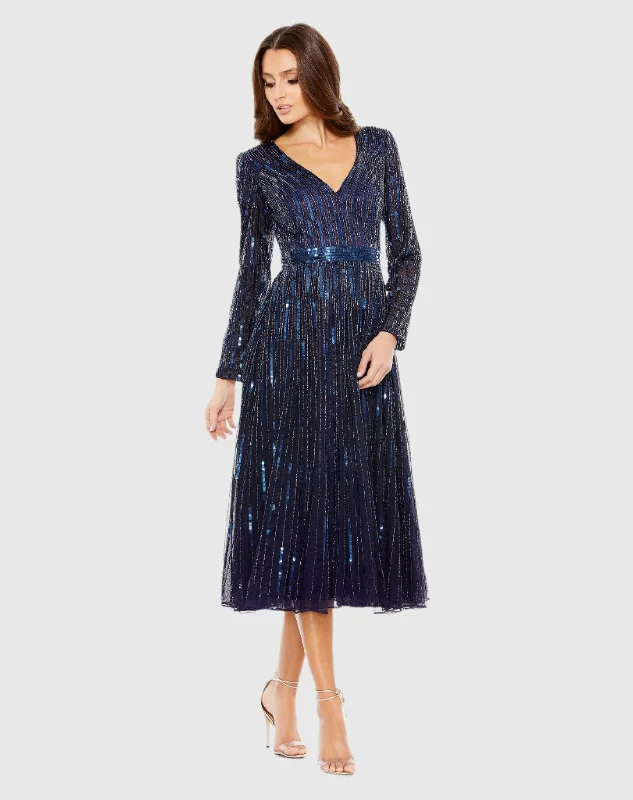 Midi dresses with ruffled sleeves for a more feminine and voluminous look Navy Long Sleeve Tea Length Dress Midi dresses with ruffled sleeves for a more feminine and voluminous look Navy Long Sleeve Tea Length Dress